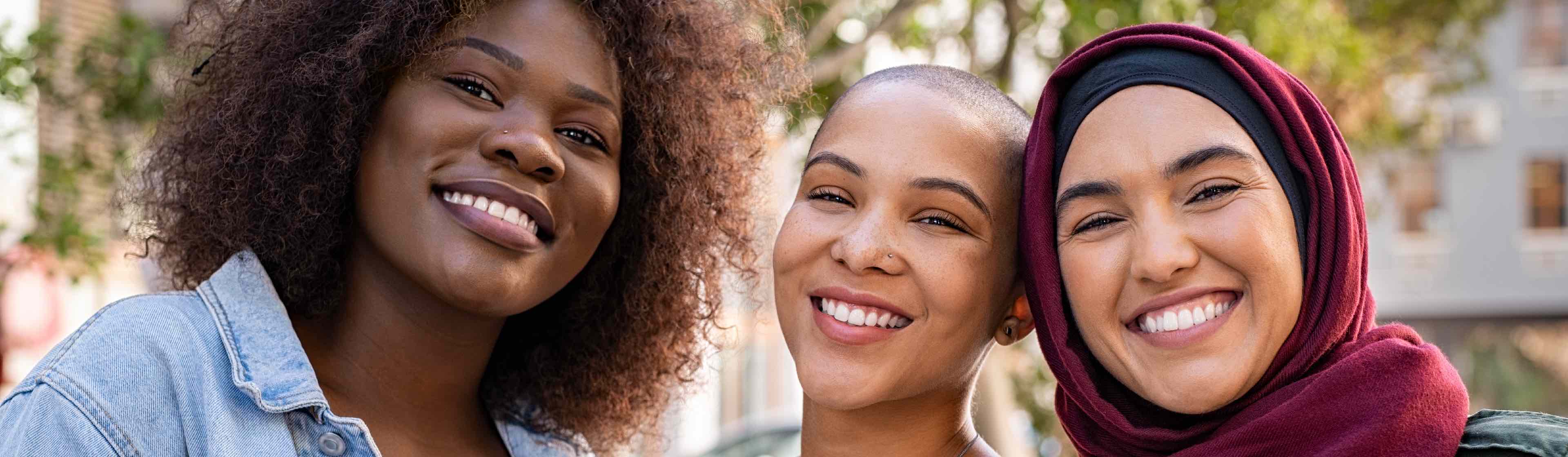 Three South African women smiling