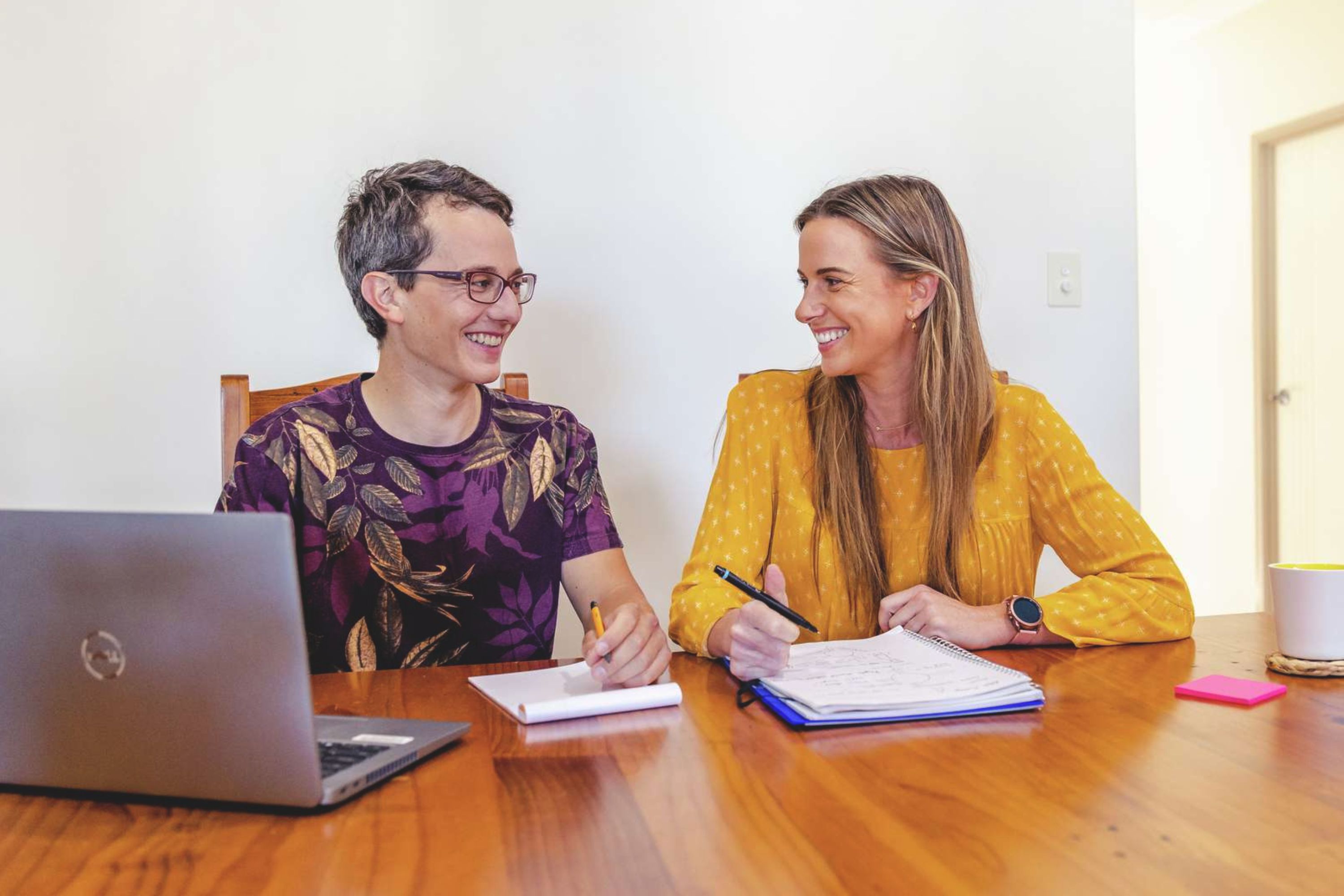 Two women sitting at a desk