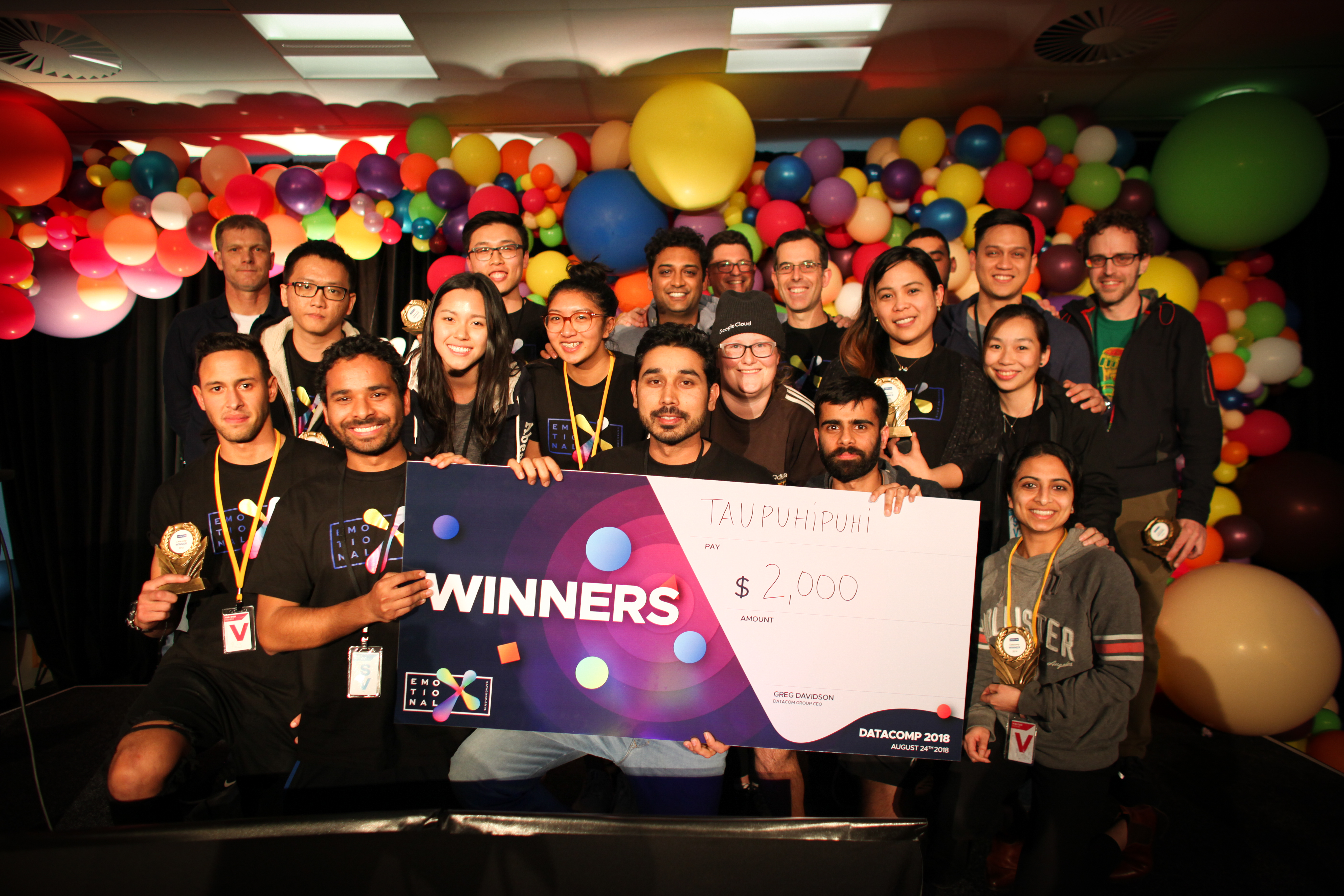 A group of people gathered as winners of Datacomp