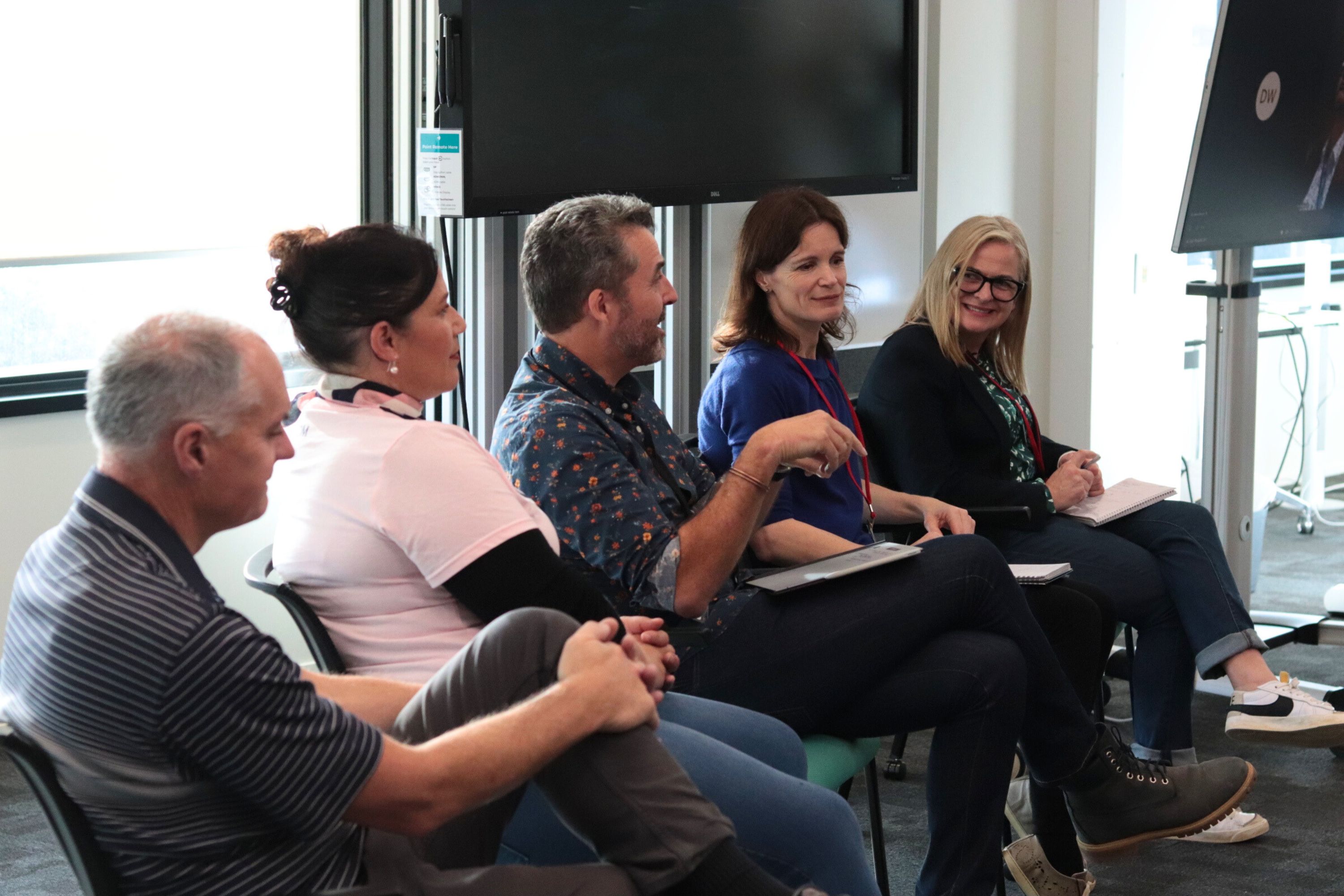 Datacom mentors sharing their knowledge in a group