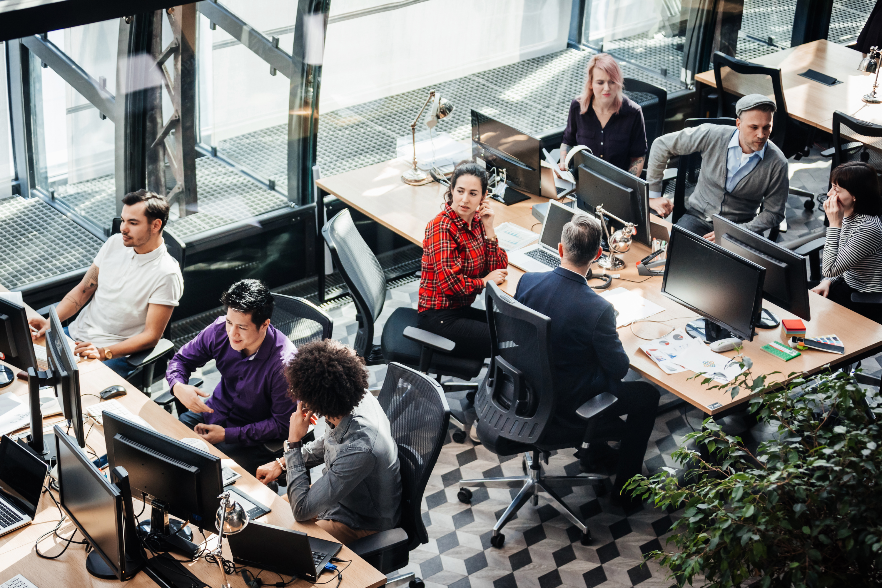 Employees at desks in workspace