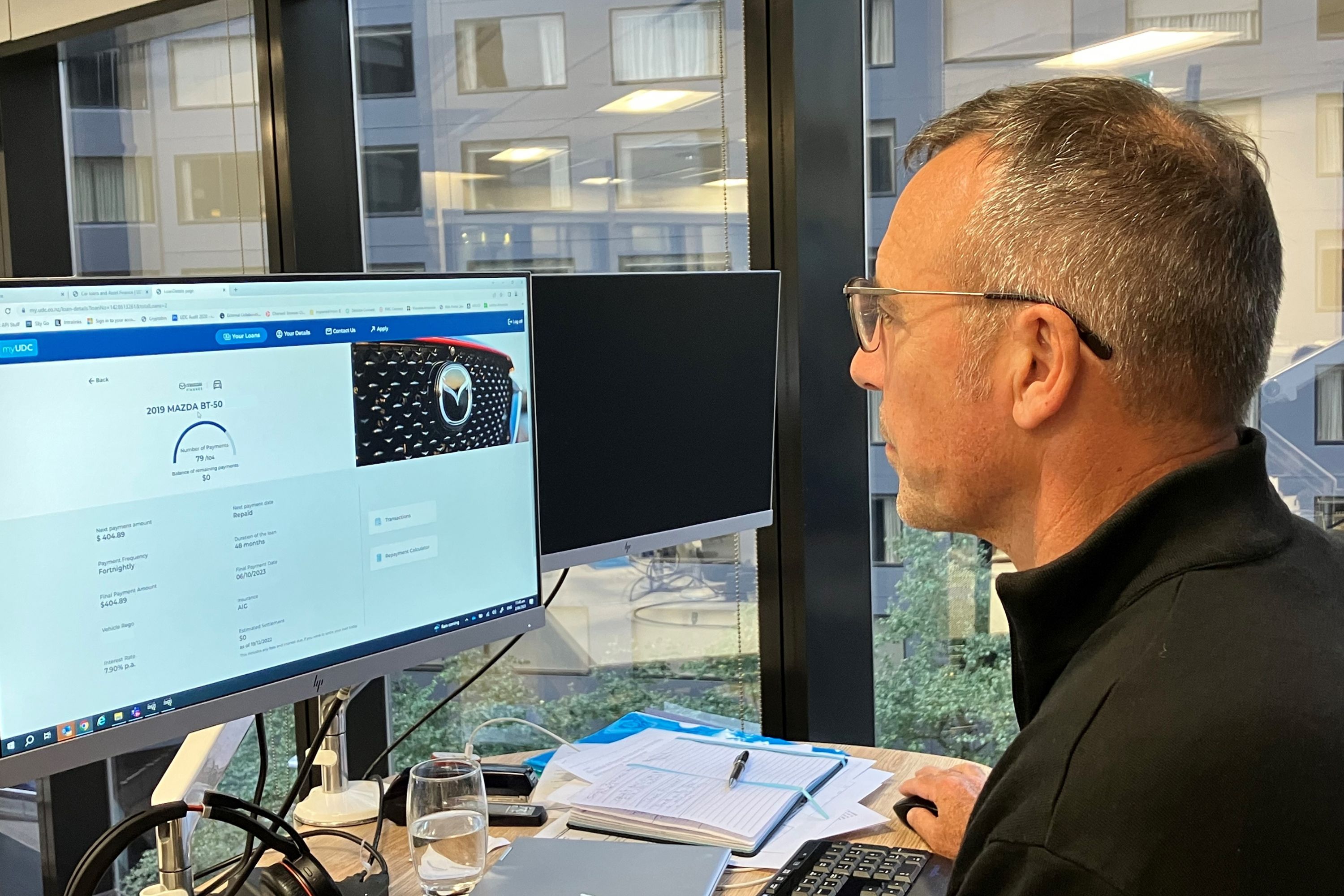 Bruce Gadsby working on a computer at a desk