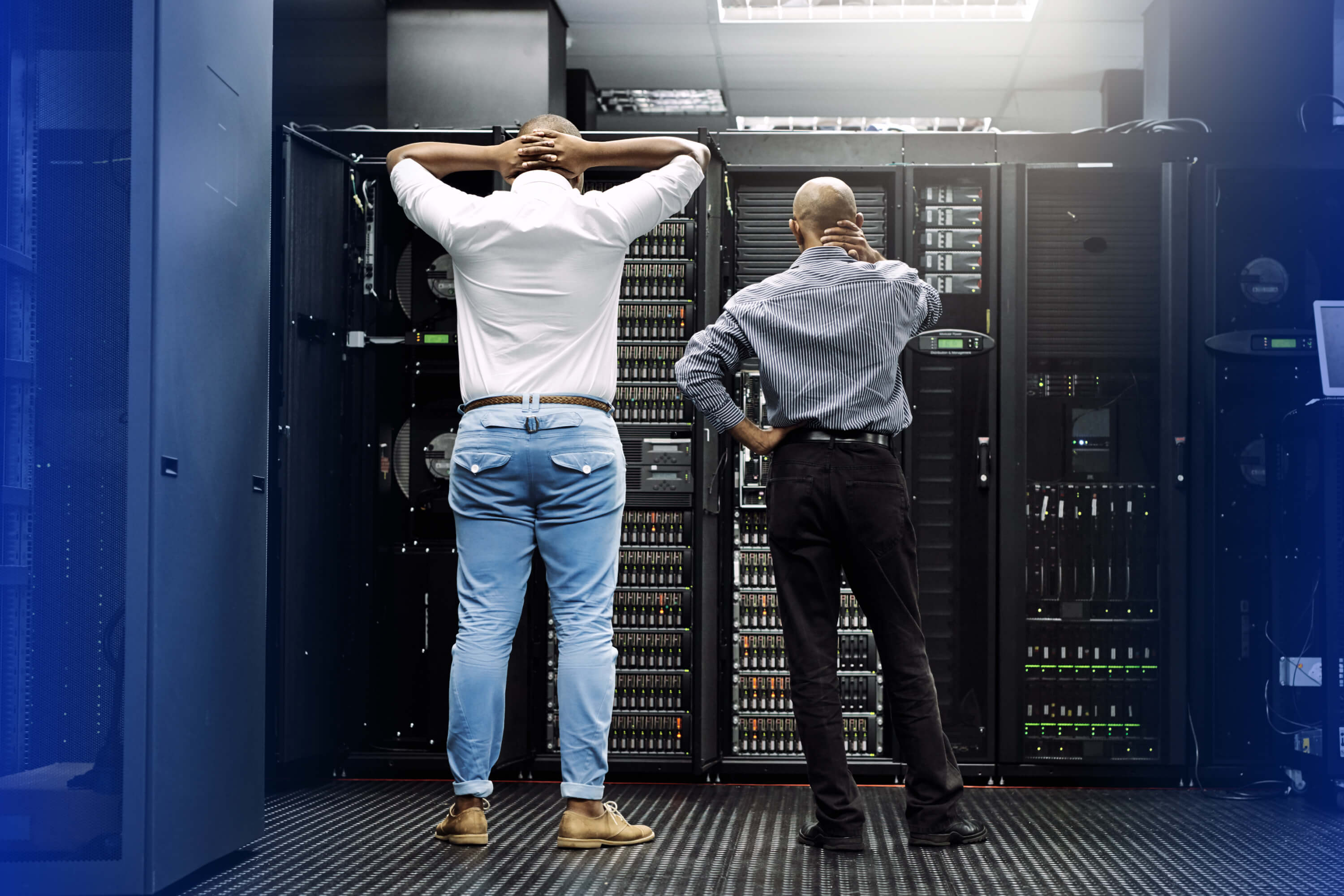 Two men looking at a server