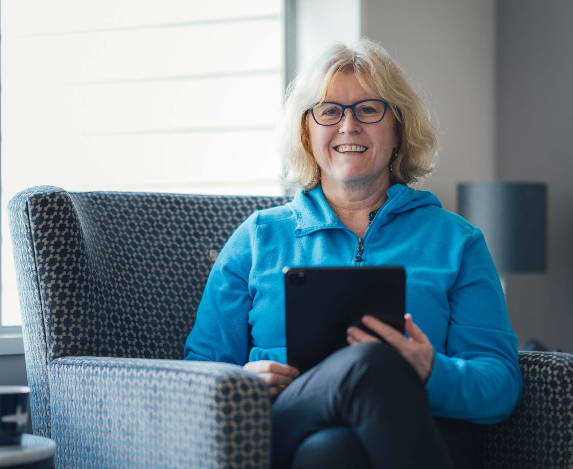 Rose Ruane holding tablet
