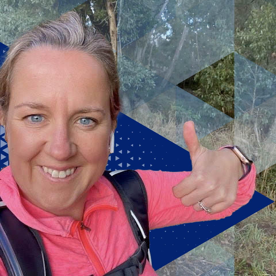 Datacom's Alex Coates holding her thumbs up