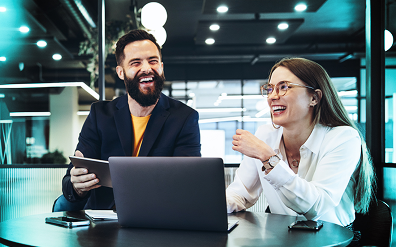 Two happy people during a consulting meeting