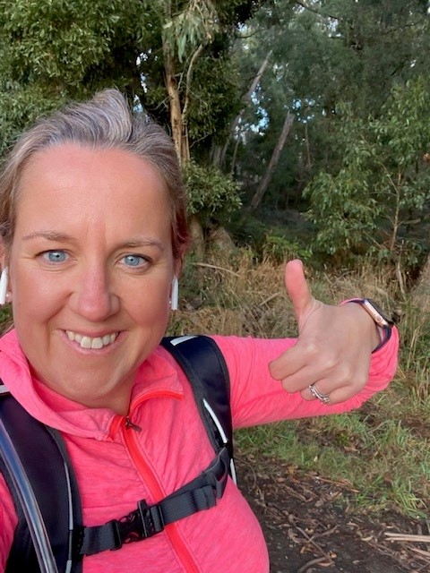 Datacom's Alex Coates holding her thumbs up